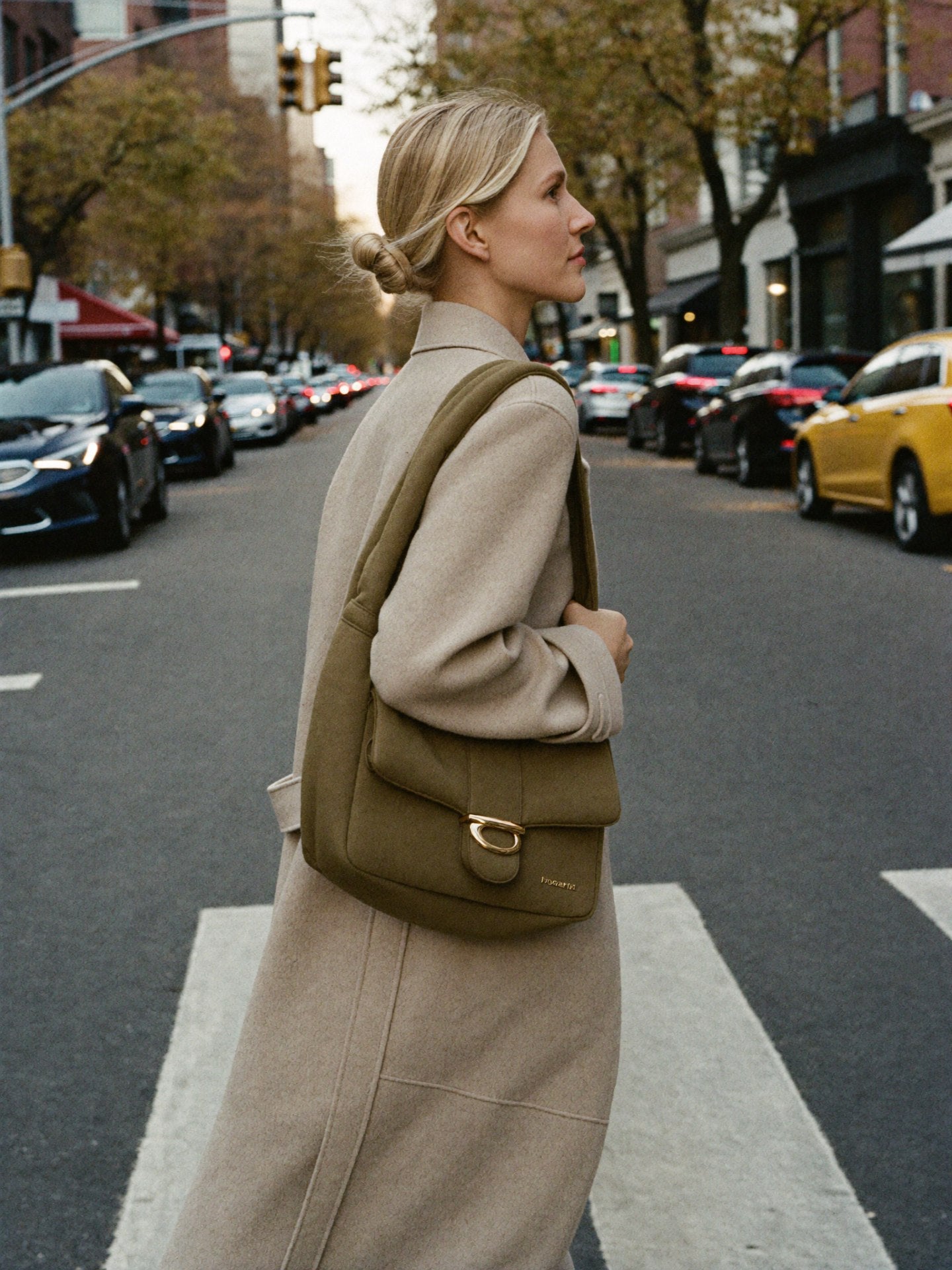 Sarah crossing NYC street with Bowryn Shoulder Bag Olive - lookbook action editorial