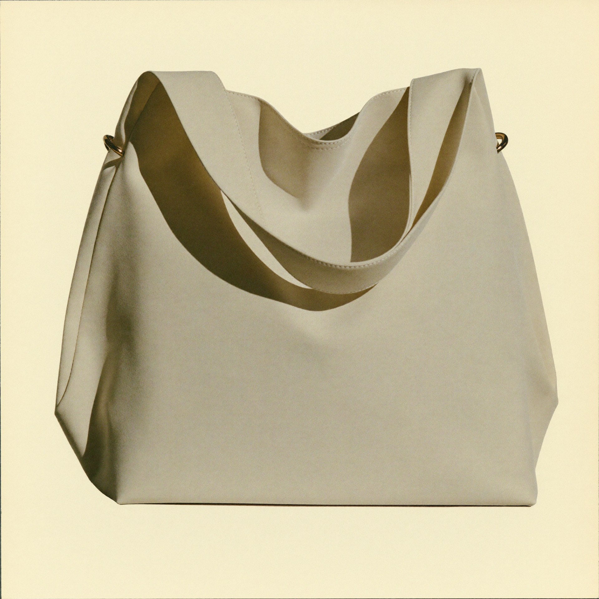 The Tote 3/4 angle showing depth and brass hardware detail