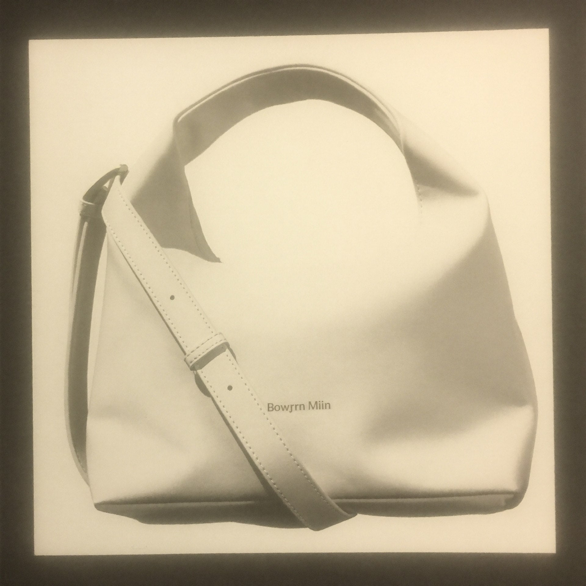 The Mini Slouch 3/4 angle showing crossbody strap detail