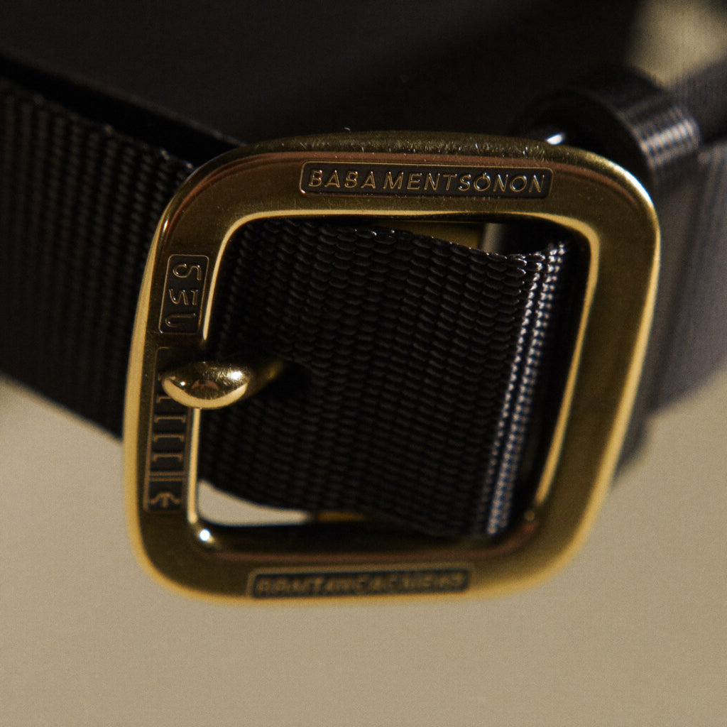 Macro detail of front zipper and side flap pockets on The Shoulder Bag