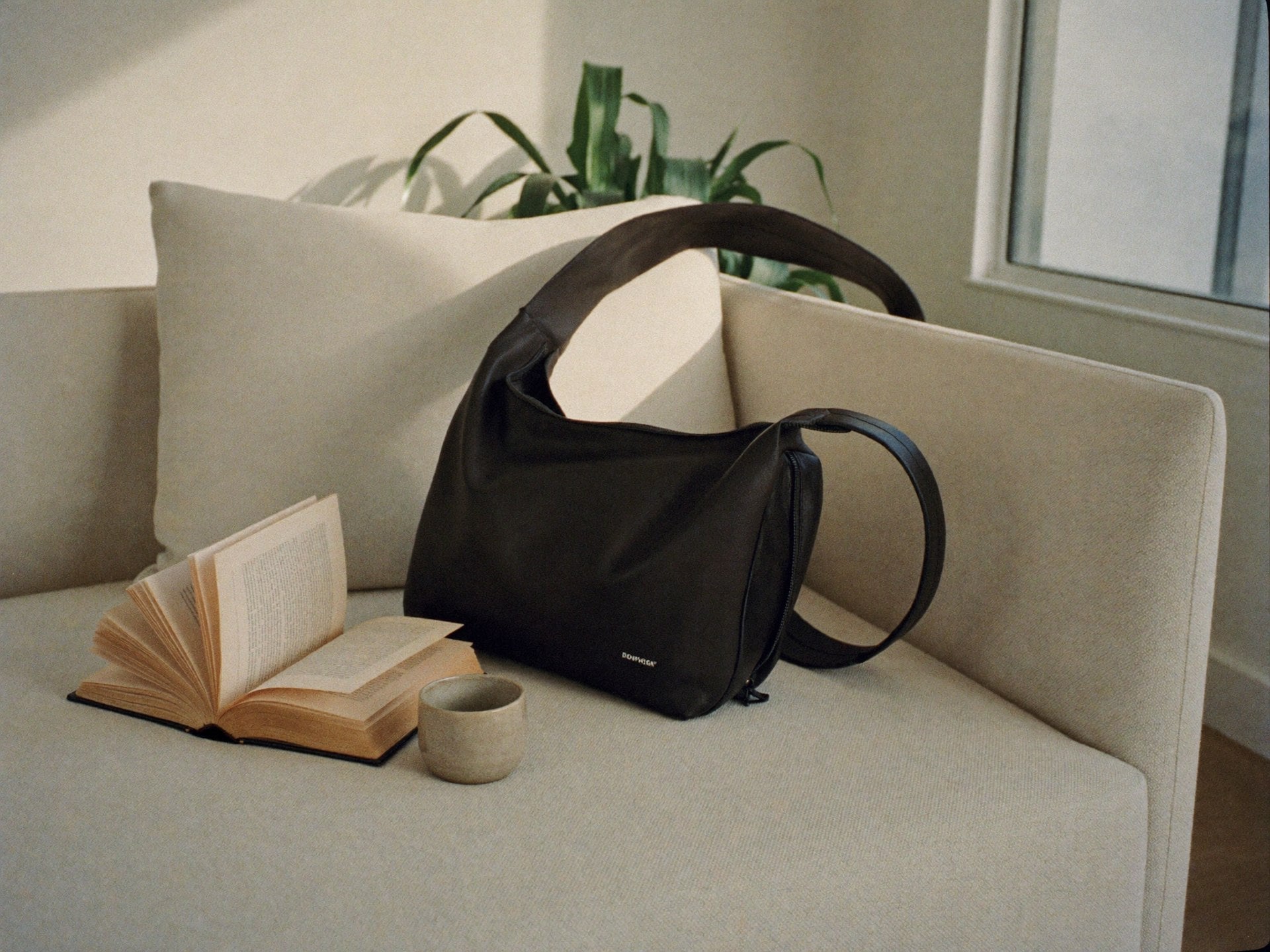 The Slouch resting on chair in minimalist weekend home setting
