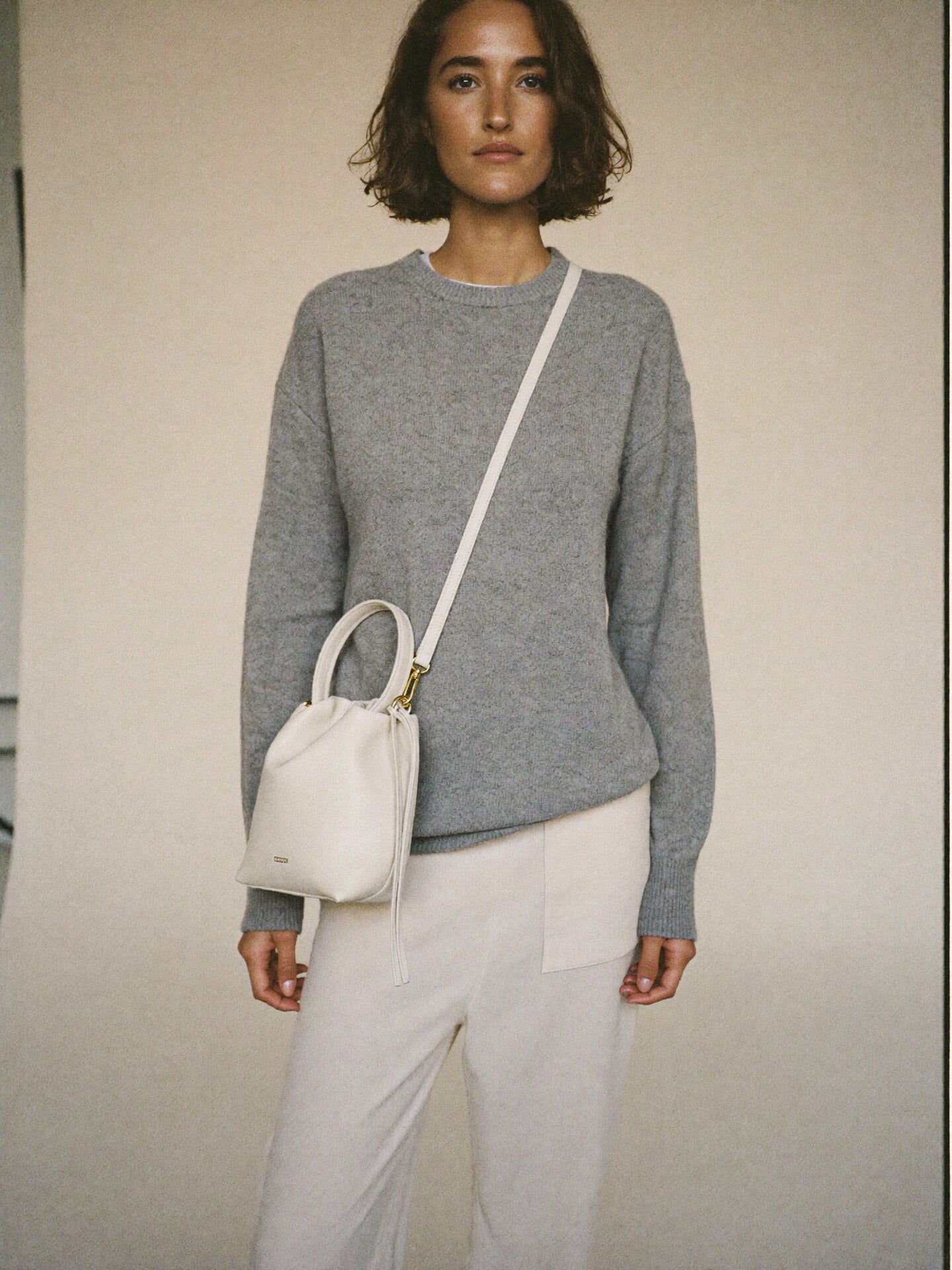 The Mini Slouch crossbody on body scale reference