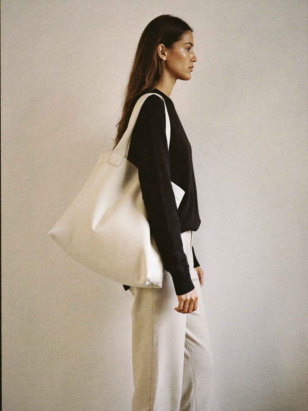 The Tote on body scale reference — size relative to woman wearing minimalist outfit