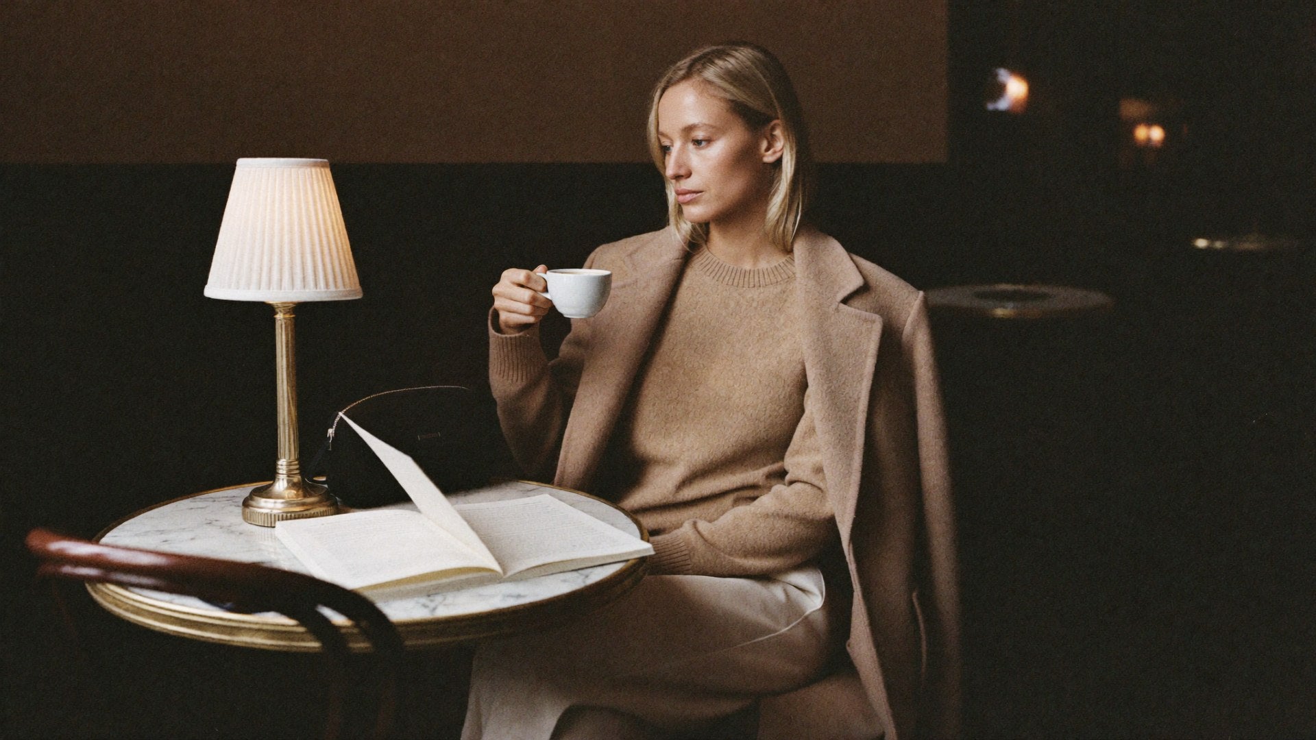 Sarah at NYC cafe interior with Bowryn Pouch - hero slideshow editorial