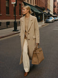 Woman walking NYC fall golden hour carrying The Tote in Camel premium nylon by Bowryn — warm beige editorial